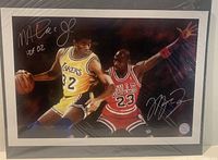 Front view showing full signed print of Magic Johnson and Michael Jordan in game action with signatures visible.