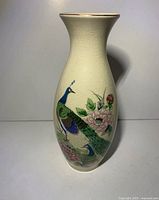 Front view of Ming Tao crackle glaze vase showing detailed peacock and flower painting