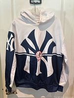Full view of New York Yankees hoodie front showing design and color blocking