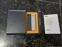 Lighter seated in case with manual visible