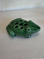 Top view showing frog shape and eight stem holes