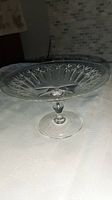 Front view of vintage crystal shallow pedestal bowl showing overall shape and height.