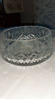 Side view of vintage Waterford Lismore crystal bowl showing diamond and starburst cut pattern and heavy base.