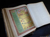 Open page with chromolithograph illuminated text