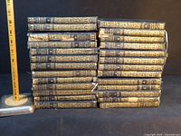 Front view of two stacks showing gilt spines of all volumes