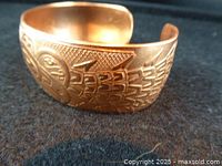 Copper cuff bracelet with Haida engraving