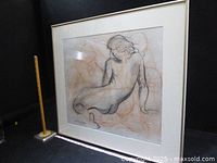 Front view of framed charcoal and pastel nude drawing