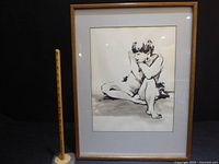 Full view of framed artwork with yardstick for scale