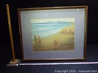 Overall view of framed watercolor painting with measuring stick and ruler for scale