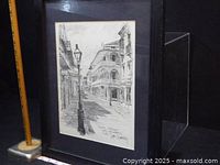 Front view of framed Don Davey sketch with ruler for scale