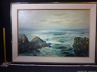 Front view of framed seascape painting