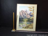 Full view of framed painting with measuring stick for scale