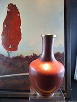 Vase in front of canvas print