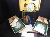 Entire lot showing three plates, boxes, miniature books, journals