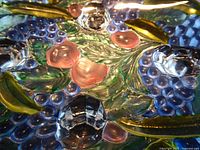 Close-up of multicolour fruit relief on bowl interior