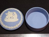 Lid and base separated showing interior and relief design