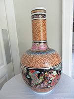 Full view of tall bulbous ceramic vase with long neck