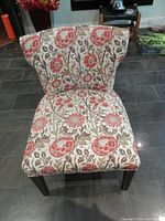 Front view of floral upholstered chair
