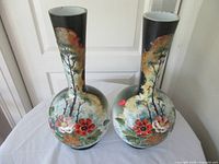 Front view of both vases showing painted motifs