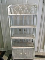 Front view showing full height, four shelves and cabinet doors