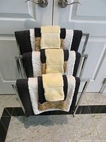 Front view of rack holding folded towels