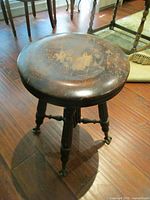 Entire stool showing legs and glass ball feet