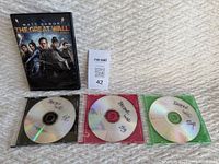 Photo showing the DVD case of The Great Wall movie starring Matt Damon and three loose DVDs labeled Doctor Who season 2, 3, and 4.
