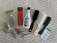 Overview of nail and hair care tools including nail polish remover, clippers, scissors, tweezers, combs, and a hairbrush.