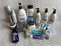 Full view of all skin, hair, and dental care items arranged on carpeted floor