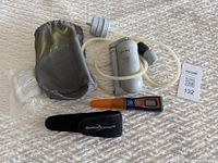 Full kit showing grey PUR microfilter with tubing and pouch, alongside orange SteriPEN Journey UV purifier with black case and clear plastic components.