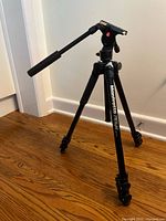 Full view of Manfrotto 290 Light tripod standing on floor