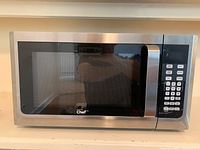 Front view of microwave showing stainless door, control panel