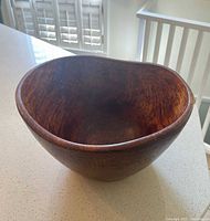 overview of brown wooden bowl on countertop