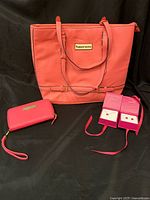 Full set showing tote bag, wallet, and pink necklace and earrings in box