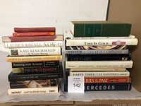 Full collection of books arranged in two stacks showing titles and condition.