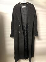 Full-length front view of coat hanging