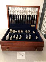 Full open chest showing knives in lid and forks, spoons and shakers in lower tray