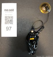 Photo of Batman Climbing Crusader toy posed upright with suction cup and rope to the side