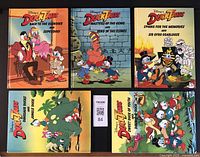 Front side of six Disney DuckTales adventure books, arranged in two rows showing colorful front covers with characters and titles.