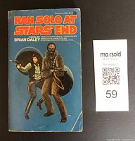 Front cover of the 1979 'Han Solo at Star's End' paperback novel showing Han Solo and Chewbacca illustration with blue background and orange title text.