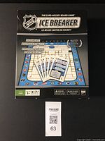 Box cover of NHL Ice Breaker card hockey board game with bilingual title and game image