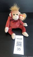 Front view of Schweetheart Orangutan Beanie Baby plush with original Ty heart tag visible.