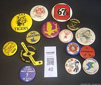 Front view of 15 vintage Ontario sports collectible buttons and pins featuring hockey and broomball league logos and tournaments.