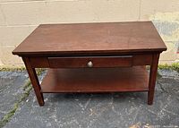 Top view of the brown wooden coffee table showing surface and shape.