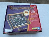 Top angled view of the colorful box packaging for Geosafari Digital Recording Lab showing graphic of device with controls and project count