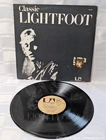 Record and front cover together showing vinyl condition and artwork