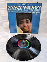 Front cover and vinyl record displayed