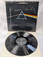 Front of gatefold jacket and record on inner sleeve