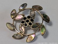 Front view showing abalone petals and onyx center