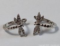 Pair of sterling silver dragonfly earrings front view